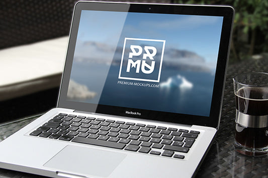 Free Macbook Pro on Table PSD Mockup