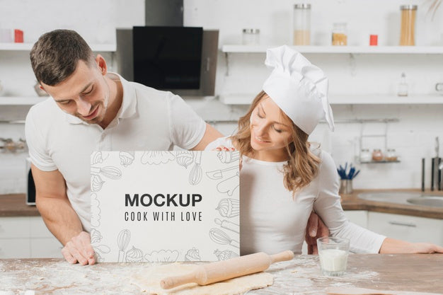 Free Male And Female Chefs Holding Blank Placard In The Kitchen Psd