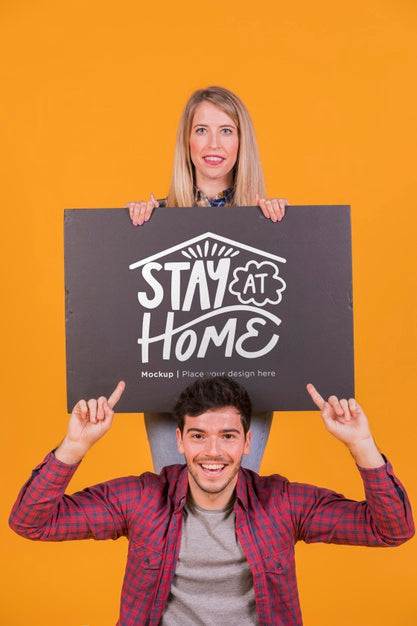 Free Man And Woman Holding A Sign Concept Mock-Up Psd