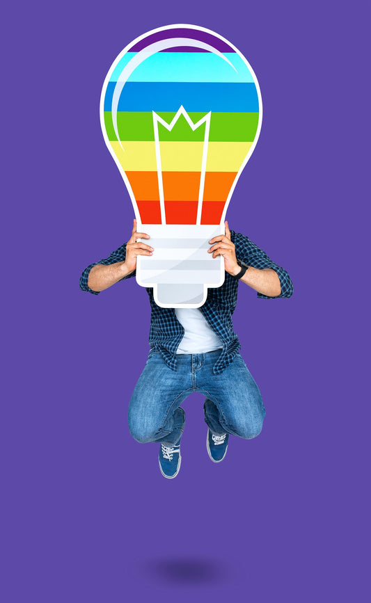 Free Man Holding A Colorful Light Bulb Icon