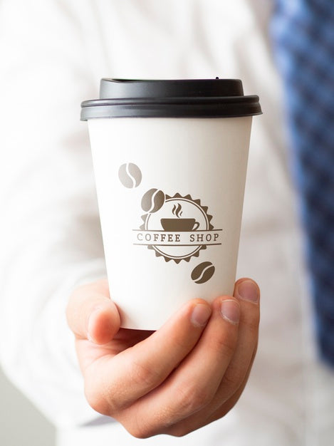 Free Man Holding A Cup Of Coffee Close-Up Psd