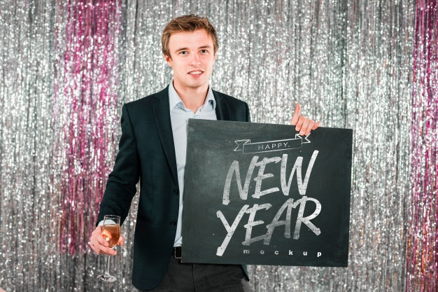 Free Man Holding Blackboard For New Year Psd