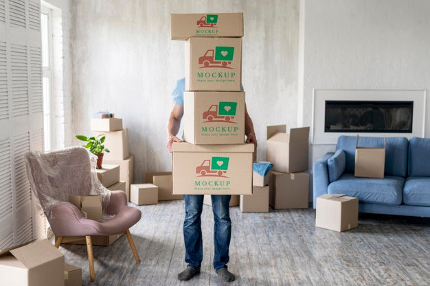 Free Man Holding Boxes With Objects Indoors Psd
