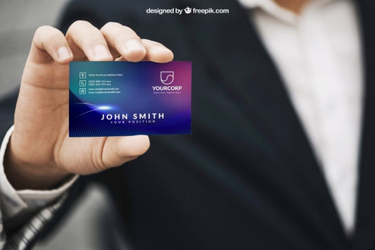 Free Business Man Holding a Business Card Mockup