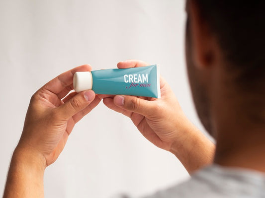 Free Man Holding Cream For Man Mock-Up Psd