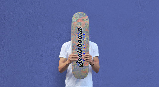 Free Man Holding Skateboard Mockup Psd