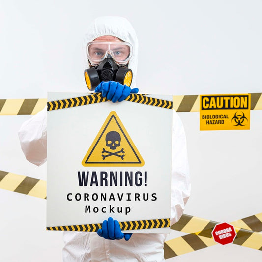 Free Man In Protection Suit Holding A Warning Coronavirus Mock-Up Psd