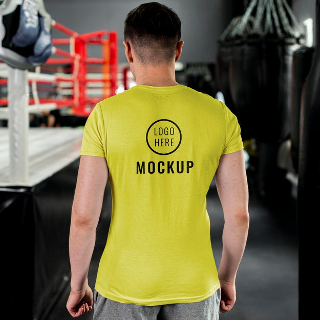 Free Man Wearing Boxing T-Shirt Mock-Up Psd