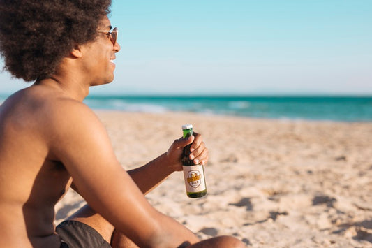 Free Man With Beer Bottle Mockup At The Beach Psd