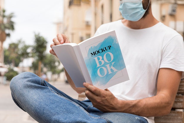 Free Man With Mask On Street Reading Book Psd