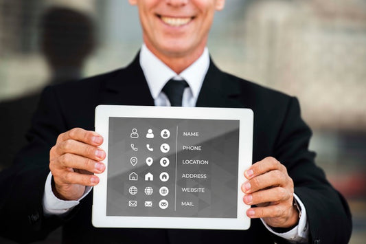 Free Medium Shot Of Smiley Man Showing Tablet For Marketing Purposes Psd