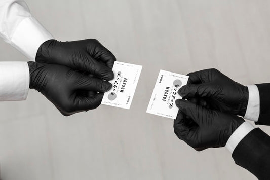 Free Men With Gloves Holding Business Cards Mock-Up Psd