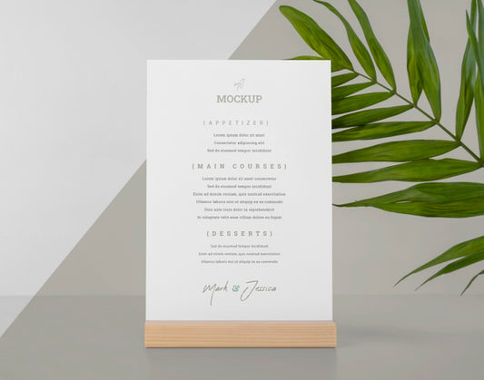 Free Menu Mock-Up With Wooden Stand And Leaf Psd