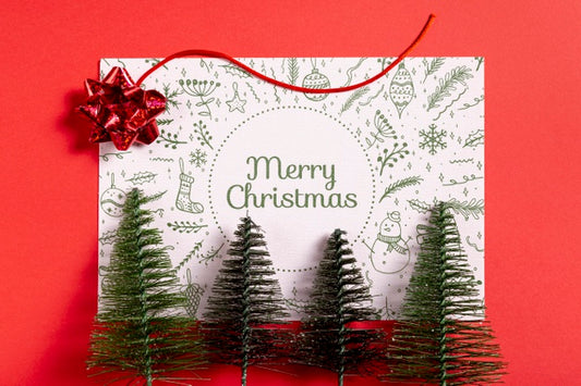 Free Merry Christmas Mock-Up Paper With Pine Trees Psd
