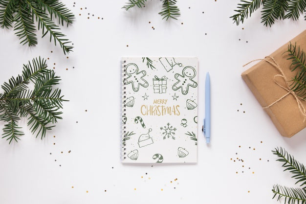 Free Merry Christmas Notebook On A Table Psd