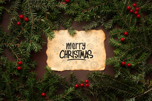 Free Merry Christmas On A Vintage Paper And Christmas Pine Leaves Psd