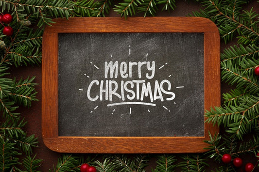 Free Merry Christmas On Chalkboard And Christmas Pine Leaves Psd