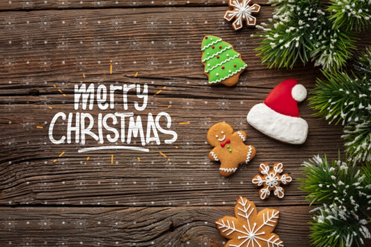 Free Merry Christmas With Gingerbread And Christmas Pine Leaves Psd