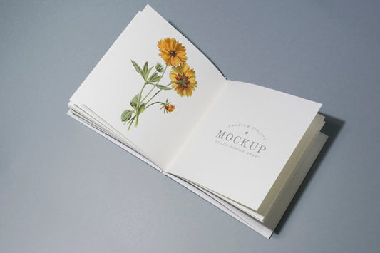 Free Mid Fold Book Mockup With Floral Illustration Psd