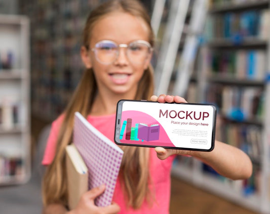 Free Mid Shot Girl In Library Showing Mock-Up Phone Psd