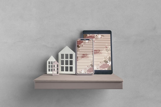 Free Miniatures Of House On Shelf Beside Electronic Devices Psd