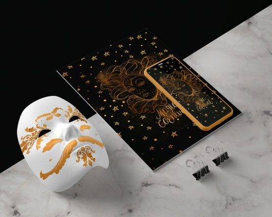Free Mobile Beside Golden Mask On Table Psd