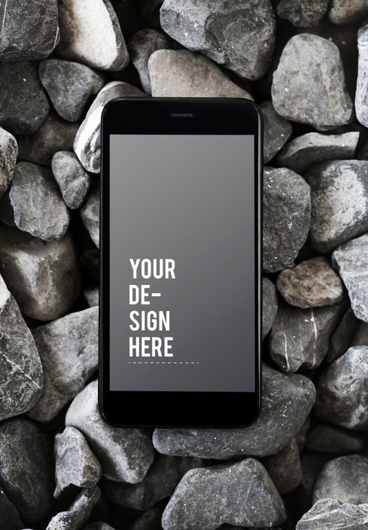 Free Mobile Phone On A Rocky Surface Psd