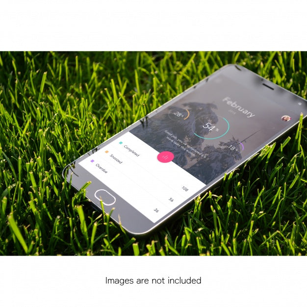 Free Mobile Phone On Grass Mock Up Psd