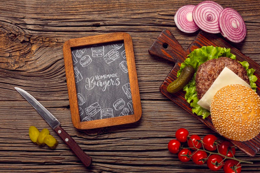 Free Mock-Up Chalkboard Frame With Burger On Wooden Background Psd