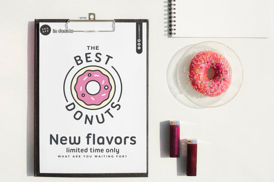 Free Mock-Up Clipboard And Sweet Snack On Desk Psd