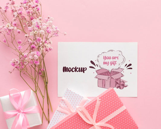 Free Mock-Up Cute Card With Wrapped Gift And Flowers Psd