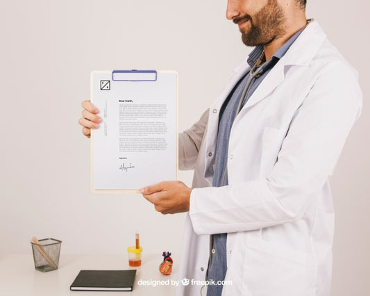 Free Mock Up Design With Smiley Doctor Holding Clipboard Psd
