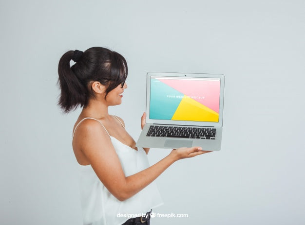 Free Mock Up Design With Woman Posing Sideways With Laptop Psd