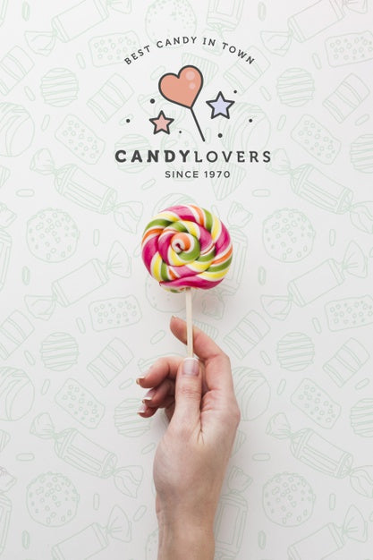 Free Mock-Up Hand With Lollipop Psd