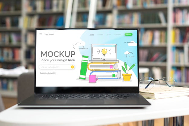 Free Mock-Up Laptop On Table In Library Psd