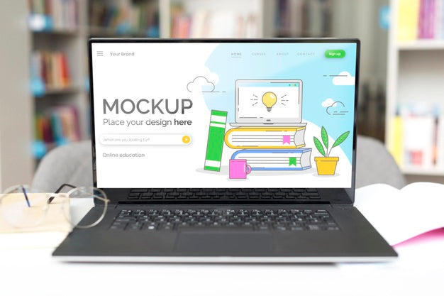 Free Mock-Up Laptop On Table In Library Psd