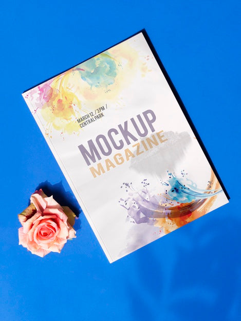 Free Mock Up Magazine And A Rose On Blue Background Psd