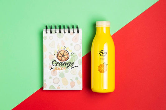 Free Mock-Up Notepad And Plastic Bottle With Smoothie Psd