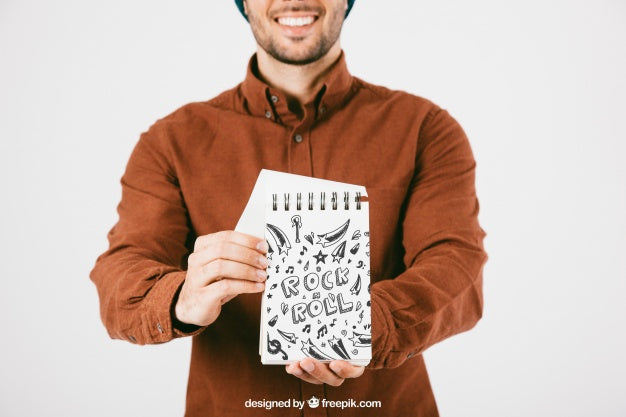 Free Mock Up Of Young Man With Notebook Psd