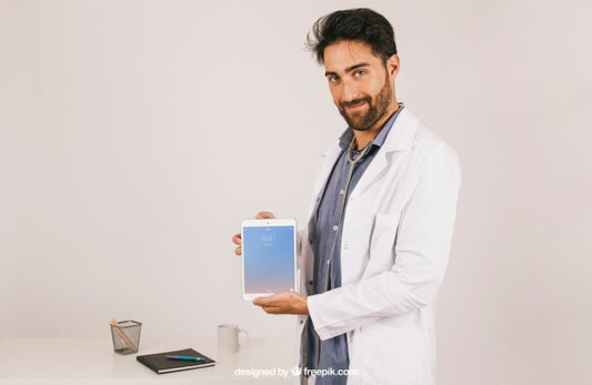 Free Mock Up With Medical Doctor Holding Tablet Psd