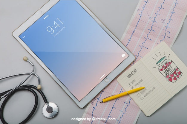 Free Mock Up With Tablet, Stethoscope, Cardiogram And Notebook Psd