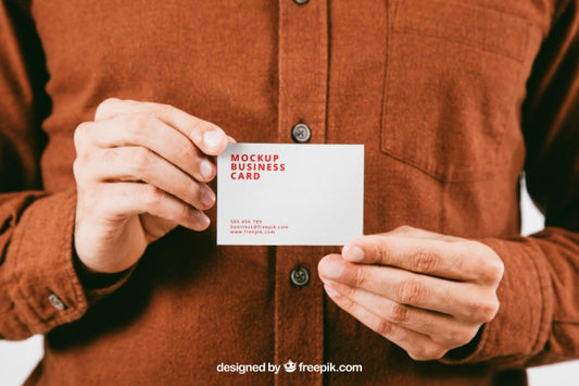 Free Mock Up With Young Man'S Hands Holding Business Card Psd