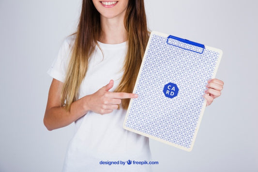 Free Mockup Concept Of Woman Pointing At Clipboard Psd