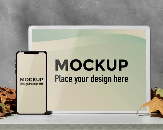 Free Mockup Devices Standing On The Table Next To Leaves Psd