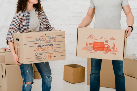 Free Mockup Of Couple With Cardboard Boxes Psd