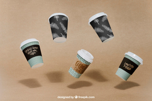 Free Mockup Of Flying Coffee Cups Psd