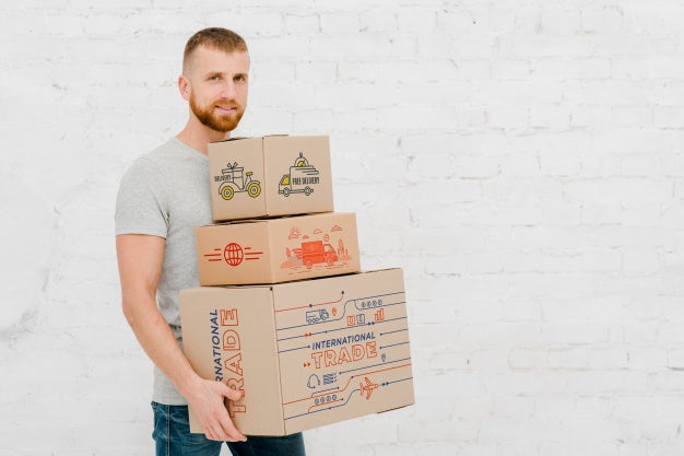 Free Mockup Of Man With Cardboard Boxes Psd