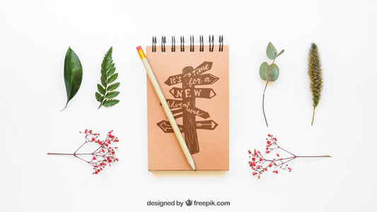 Free Mockup Of Notepad And Leaves Psd