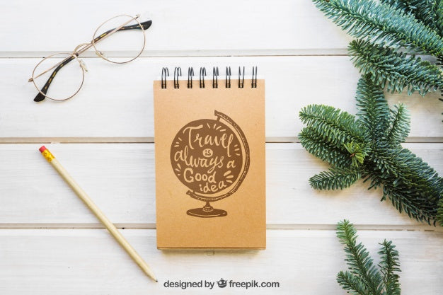 Free Mockup Of Notepad Next To Fir Branches Psd