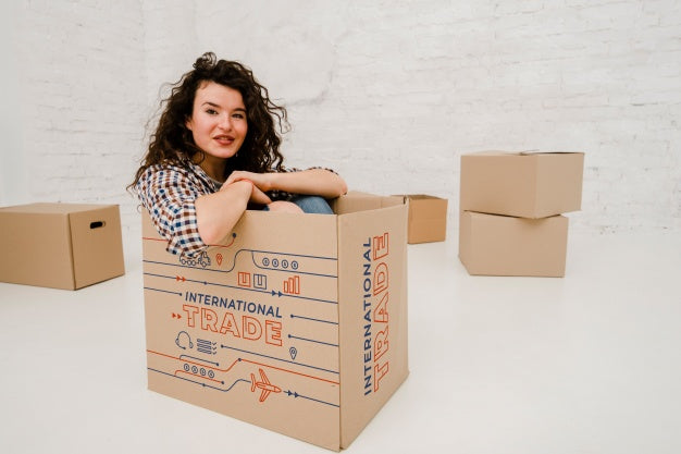 Free Mockup Of Woman With Cardboard Boxes Psd